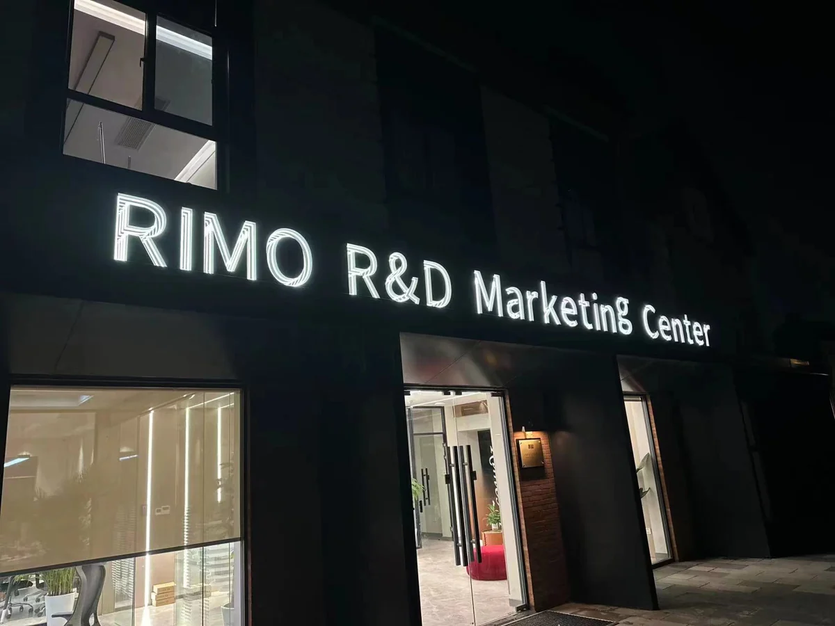 White RIMO R&D Marketing Center lettering above a commercial entrance